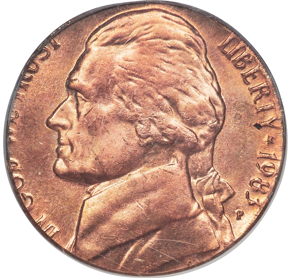1983 Jefferson nickel struck on a copper cent planchet showing reddish-brown color compared to a normal silver-gray nickel