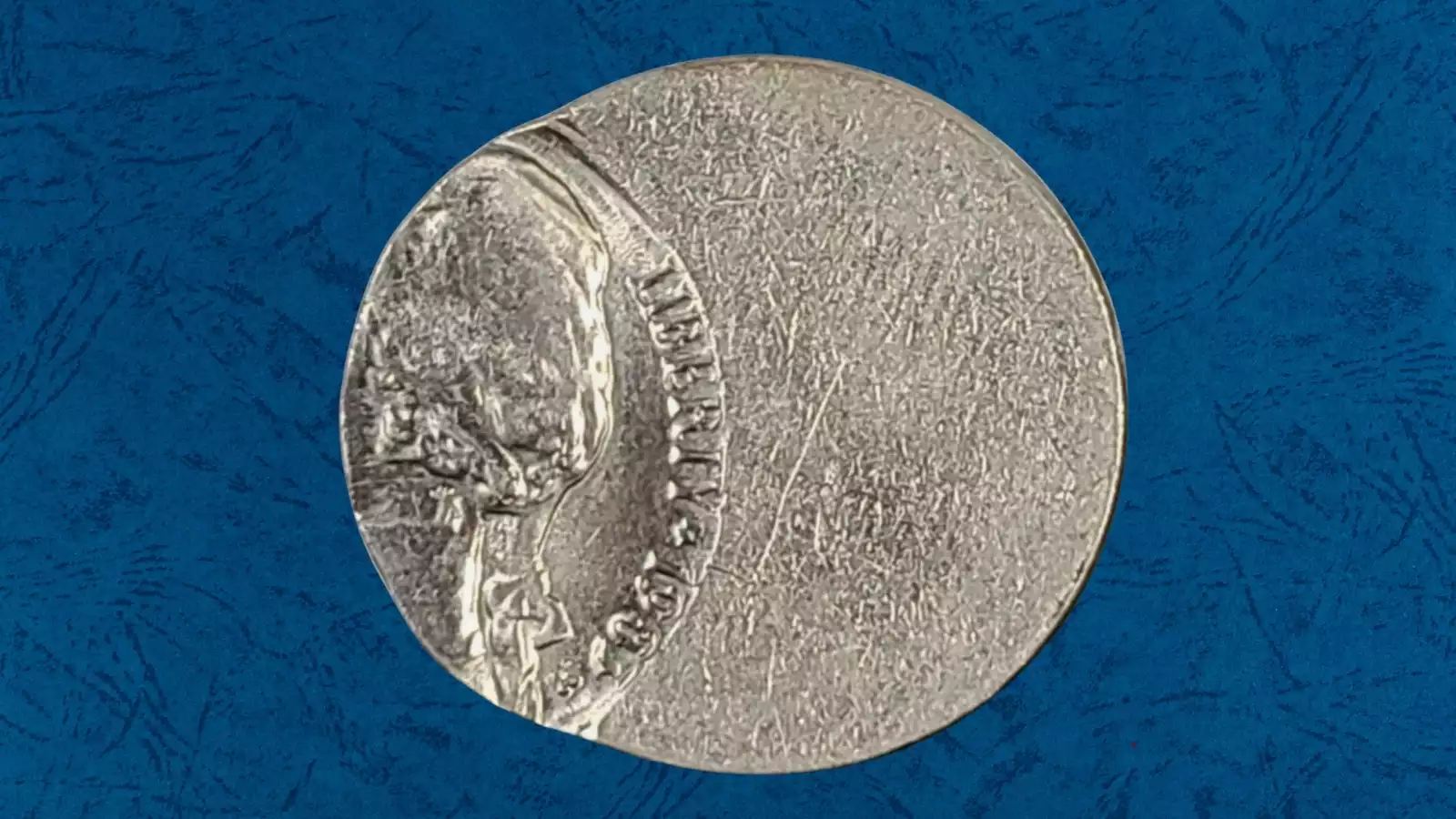 1983 Jefferson nickel with off-center strike showing the design shifted noticeably from center with a plain blank crescent on one side